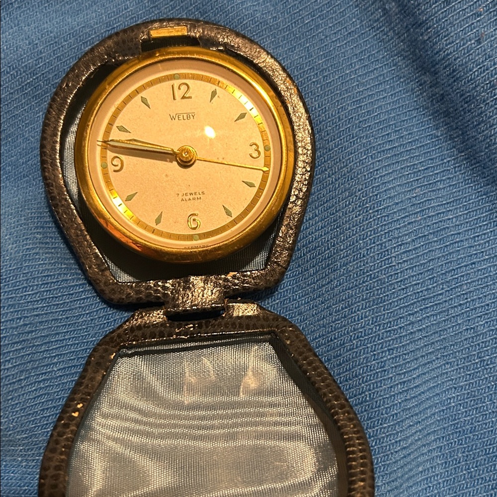 a vintage Welby 7-jewel travel alarm clock, manufactured in Germany